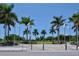 Inviting park entrance with tall palm trees and flags, welcoming visitors to enjoy the park's amenities at 835 S Osprey Ave # 310, Sarasota, FL 34236