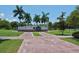 Park signage at the entrance with detailed information, surrounded by well-manicured lawns and walkways at 835 S Osprey Ave # 310, Sarasota, FL 34236