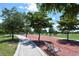 Scenic walking path lined with trees and a bench, perfect for a leisurely stroll or enjoying nature at 835 S Osprey Ave # 310, Sarasota, FL 34236