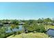 Expansive water view featuring lush greenery and waterfront scenery from a high vantage point at 835 S Osprey Ave # 310, Sarasota, FL 34236