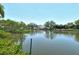 Picturesque waterfront scene showcasing calm waters and beautiful waterfront homes under a clear sky at 835 S Osprey Ave # 310, Sarasota, FL 34236