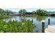 Scenic waterfront view featuring lush greenery and attractive homes along the canal at 835 S Osprey Ave # 310, Sarasota, FL 34236
