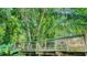 Wooden bridge through dense greenery in the botanical gardens at 835 S Osprey Ave # 310, Sarasota, FL 34236