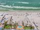 Aerial view of the beach, hotel, and beachfront pool at 915 Seaside Dr # 405 Weeks 22-23, Sarasota, FL 34242