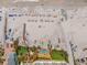 Aerial view of a sandy beach featuring a pool and beachfront property at 915 Seaside Dr # 405 Weeks 22-23, Sarasota, FL 34242