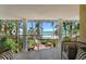Balcony view of the beach and resort area, with seating at 915 Seaside Dr Weeks 22-23 # 405, Sarasota, FL 34242