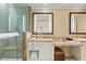 Elegant bathroom featuring dual sinks, granite countertops, and a glass-enclosed shower at 915 Seaside Dr # 405 Weeks 22-23, Sarasota, FL 34242