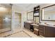 Spacious bathroom featuring a tiled shower, double vanity, and decorative tiled flooring at 915 Seaside Dr # 405 Weeks 22-23, Sarasota, FL 34242