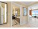 Hallway view of bathroom featuring a tub, tile floors, and a mirrored sink at 915 Seaside Dr # 405 Weeks 22-23, Sarasota, FL 34242