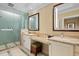 Bright bathroom boasts a double vanity, granite counters, decorative tile, and glass shower at 915 Seaside Dr # 405 Weeks 22-23, Sarasota, FL 34242