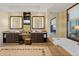 Luxurious bathroom featuring double vanity, large mirror, and soaking tub at 915 Seaside Dr # 405 Weeks 22-23, Sarasota, FL 34242