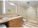Bright bathroom with marble counters, modern vanity and glass enclosed shower at 915 Seaside Dr # 405 Weeks 22-23, Sarasota, FL 34242