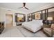 Bright bedroom featuring a ceiling fan, neutral color palette, and decorative wall paneling detail at 915 Seaside Dr # 405 Weeks 22-23, Sarasota, FL 34242