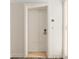 White paneled door to the unit featuring a brushed metal handle, peephole, and unit number at 915 Seaside Dr # 405 Weeks 22-23, Sarasota, FL 34242