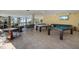 Spacious game room with tile floor, billiard and ping pong tables, seating, and tv at 915 Seaside Dr # 405 Weeks 22-23, Sarasota, FL 34242