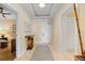 Inviting hallway with tiled flooring, decorative rug, console table and soft, neutral walls at 915 Seaside Dr # 405 Weeks 22-23, Sarasota, FL 34242