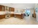 Open kitchen with custom cabinets, tile floors and stainless steel appliances overlooking ocean at 915 Seaside Dr # 405 Weeks 22-23, Sarasota, FL 34242
