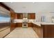 Modern kitchen with custom cabinets, stainless steel appliances and tile flooring at 915 Seaside Dr # 405 Weeks 22-23, Sarasota, FL 34242