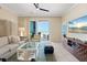 Bright living room with access to balcony with a view of the beach at 915 Seaside Dr # 405 Weeks 22-23, Sarasota, FL 34242