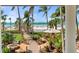 View of the beach and tropical resort with beach bar at 915 Seaside Dr # 405 Weeks 22-23, Sarasota, FL 34242