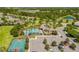 Community amenities include a pool, basketball court, and ample parking surrounded by lush greenery at 11319 82Nd E St, Parrish, FL 34219