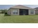 Home featuring a spacious, well-maintained backyard with a screened in patio at 11319 82Nd E St, Parrish, FL 34219