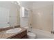 Well-lit bathroom with a vanity, toilet, and shower-tub combo at 11319 82Nd E St, Parrish, FL 34219