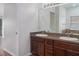 Bathroom featuring double sinks and a large mirror at 11319 82Nd E St, Parrish, FL 34219