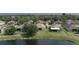Scenic view of a tranquil pond surrounded by well-maintained homes and lush greenery at 11319 82Nd E St, Parrish, FL 34219