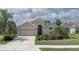 Charming single-Gathering home features a two-car garage, complemented by mature landscaping and a well-manicured lawn at 11319 82Nd E St, Parrish, FL 34219