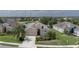 Inviting single-story home with a well-manicured lawn, complemented by lush landscaping and a tranquil pond view at 11319 82Nd E St, Parrish, FL 34219