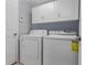 Laundry room with washer and dryer and white cabinets at 11319 82Nd E St, Parrish, FL 34219