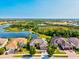 Stunning aerial view of the community showcasing lakes, landscaping, and beautiful homes at 13644 Brilliante Dr, Venice, FL 34293
