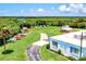 The South Venice Yacht Club features lush lawns, a recreational area, and boat storage for kayaking enthusiasts at 13644 Brilliante Dr, Venice, FL 34293
