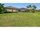 Well-maintained home with screened lanai and spacious lawn offering a tranquil backyard setting at 13644 Brilliante Dr, Venice, FL 34293