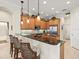 Kitchen with granite countertops, breakfast bar, stainless steel appliances, and pendant lighting at 13644 Brilliante Dr, Venice, FL 34293