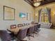 Conference room boasts beautiful decor, a large table with executive chairs, and ample natural light at 13644 Brilliante Dr, Venice, FL 34293