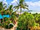 Scenic view of pier and beach from lush landscaping at 13644 Brilliante Dr, Venice, FL 34293