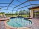 Screened lanai featuring a pool, spa, and outdoor seating with a view at 13644 Brilliante Dr, Venice, FL 34293
