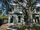 New construction home featuring block construction, large windows, and lush landscaping at 1423 S Shade Ave, Sarasota, FL 34239