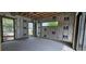 Unfinished room featuring green wood trim, insulation, and windows for natural light at 1423 S Shade Ave, Sarasota, FL 34239