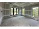 Unfinished living room with drywall showing windows and in-wall wiring during the new construction process at 1423 S Shade Ave, Sarasota, FL 34239