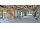 Unfinished living room with exposed framing, ductwork, and in-wall wiring showing construction progress at 1423 S Shade Ave, Sarasota, FL 34239