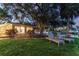 Tranquil waterfront backyard with lounge chairs, providing a perfect spot to unwind and enjoy the peaceful water views at 1542 Gulfview Dr, Sarasota, FL 34236