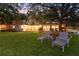Backyard featuring patio, lounge chairs, and waterfront access, perfect for outdoor living and enjoying scenic views at 1542 Gulfview Dr, Sarasota, FL 34236