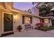 Charming front entrance with a decorative door, front porch, and lush landscaping at 1542 Gulfview Dr, Sarasota, FL 34236