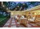 Cozy outdoor patio featuring brick flooring, comfortable seating, and a relaxing space for outdoor enjoyment at 1542 Gulfview Dr, Sarasota, FL 34236
