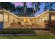 Expansive outdoor patio with ample seating, perfect for enjoying outdoor entertaining and serene backyard views at 1542 Gulfview Dr, Sarasota, FL 34236