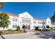 Classic white school building with red tile roof and manicured landscaping at 1542 Gulfview Dr, Sarasota, FL 34236