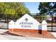 Attractive school sign with black fence, trees, and playground in background at 1542 Gulfview Dr, Sarasota, FL 34236